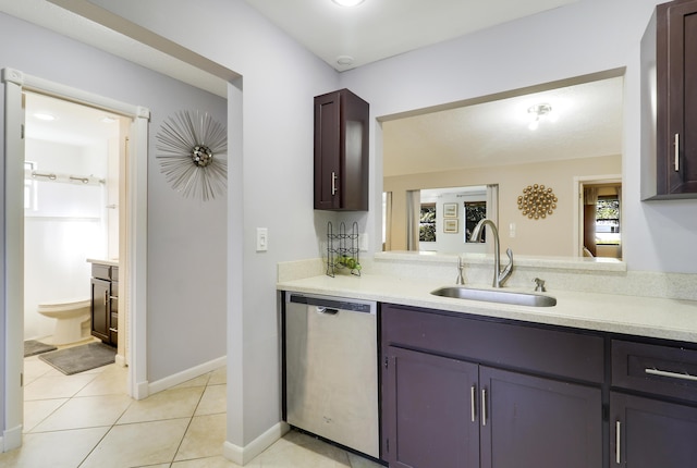 kitchen with dishwasher, dark brown cabinets, light tile patterned floors, and sink