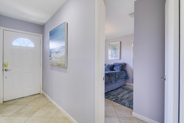 entryway featuring light tile patterned floors