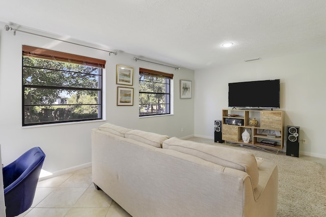 tiled living room with a textured ceiling