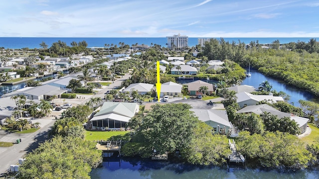 drone / aerial view with a water view