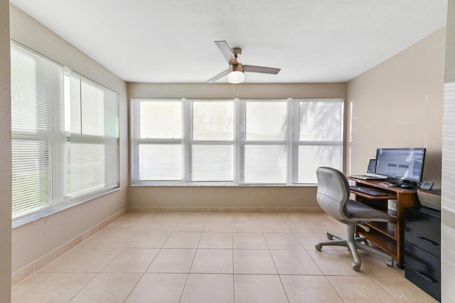 tiled office featuring ceiling fan