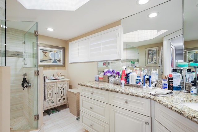 bathroom with vanity and walk in shower