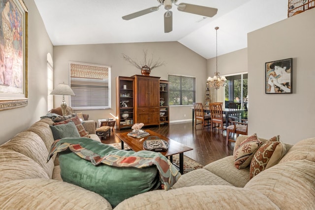 living room featuring lofted ceiling, ceiling fan with notable chandelier, and dark hardwood / wood-style flooring