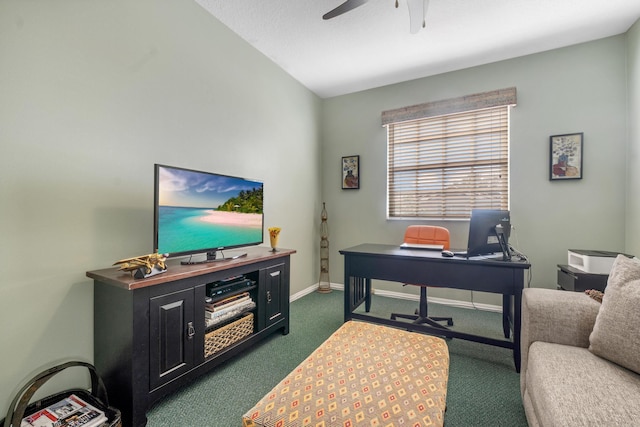 carpeted home office featuring ceiling fan