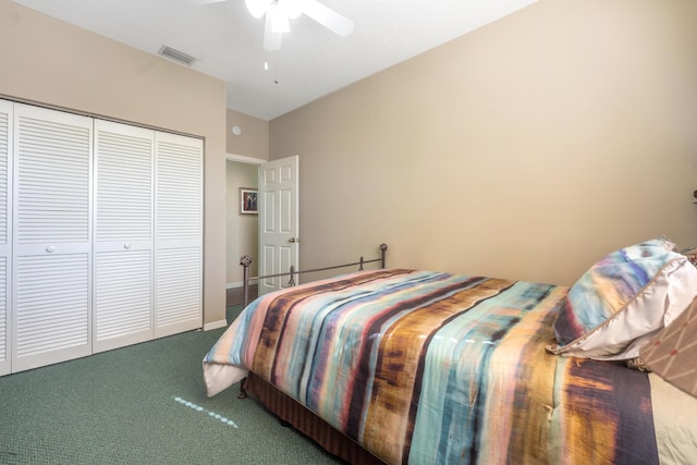 carpeted bedroom featuring ceiling fan and a closet