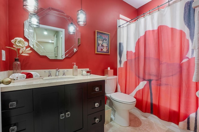 bathroom featuring tile patterned flooring, vanity, curtained shower, and toilet