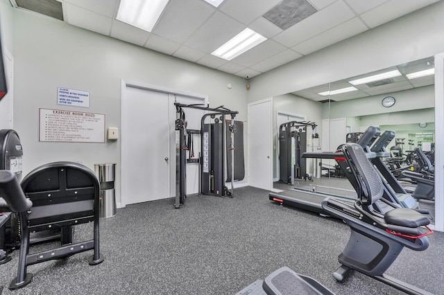 exercise room with a paneled ceiling