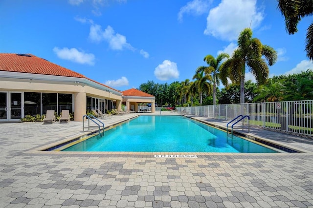 view of swimming pool featuring a patio area