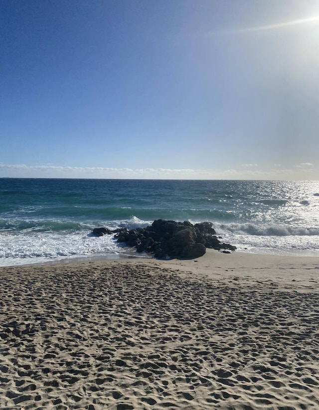 view of water feature featuring a beach view