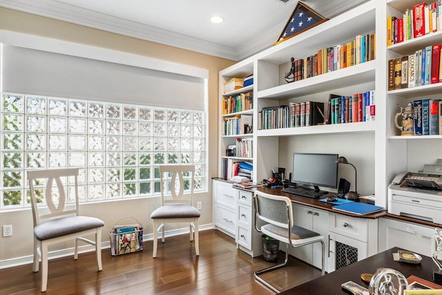 office area with built in desk, dark hardwood / wood-style flooring, built in features, and ornamental molding