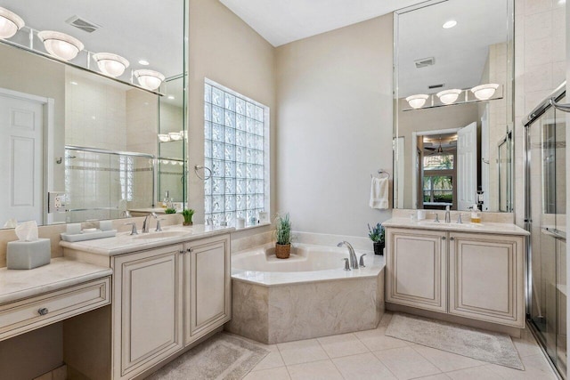 bathroom featuring separate shower and tub, tile patterned floors, and vanity