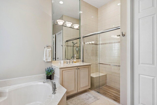 bathroom with vanity, tile patterned floors, and independent shower and bath