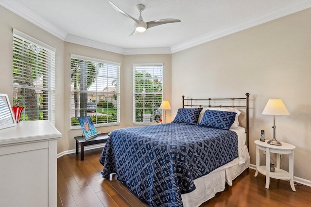 bedroom featuring a textured ceiling, crown molding, ceiling fan, and dark wood-type flooring