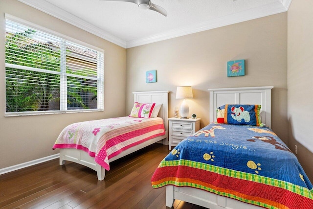 bedroom with dark hardwood / wood-style flooring, ceiling fan, and crown molding