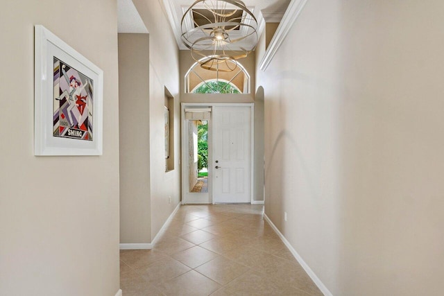 tiled entrance foyer with a high ceiling