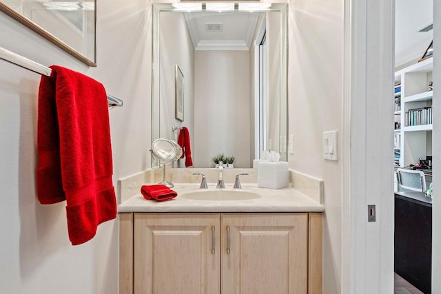 bathroom featuring vanity and crown molding