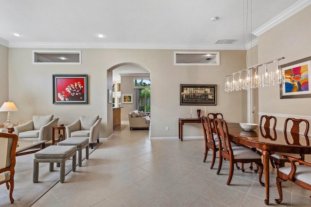 dining space with crown molding, light tile patterned flooring, and a textured ceiling