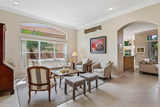 living room featuring a textured ceiling, light tile patterned floors, crown molding, and a wealth of natural light