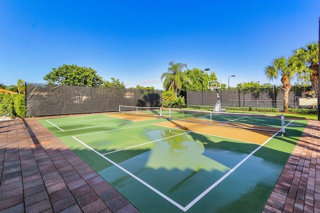 view of sport court featuring basketball hoop