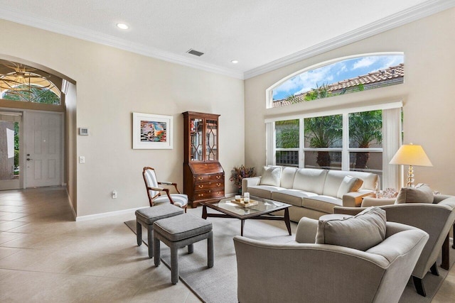 tiled living room featuring ornamental molding and a textured ceiling