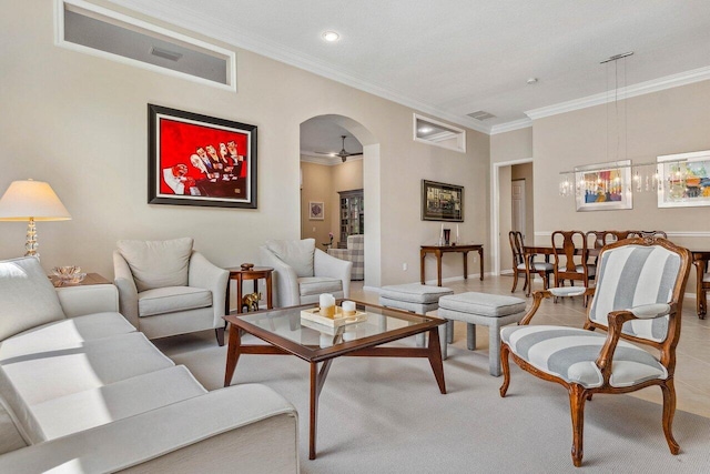 living room featuring ceiling fan and crown molding