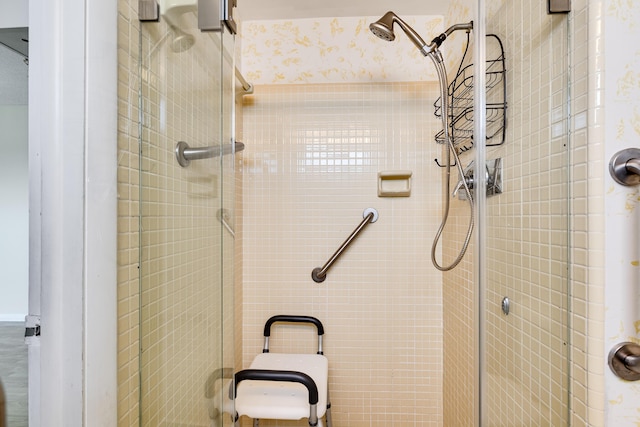 bathroom with a shower with shower door