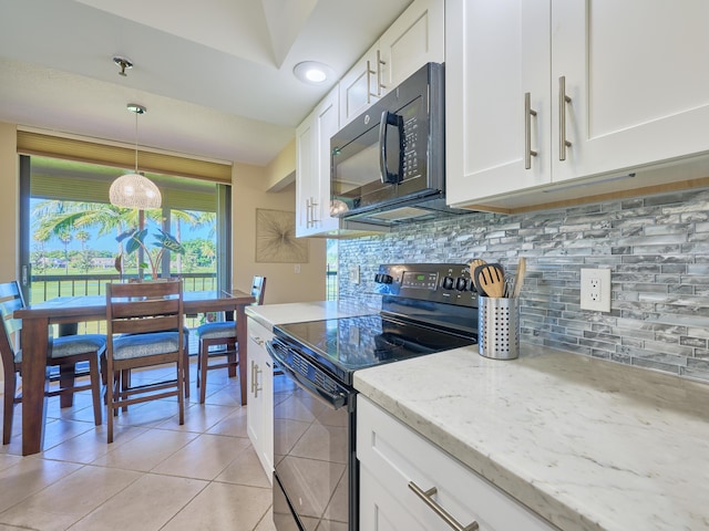 kitchen featuring decorative backsplash, light stone counters, black appliances, pendant lighting, and white cabinetry