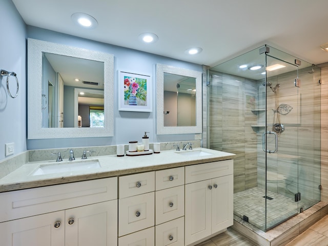 bathroom featuring vanity and walk in shower