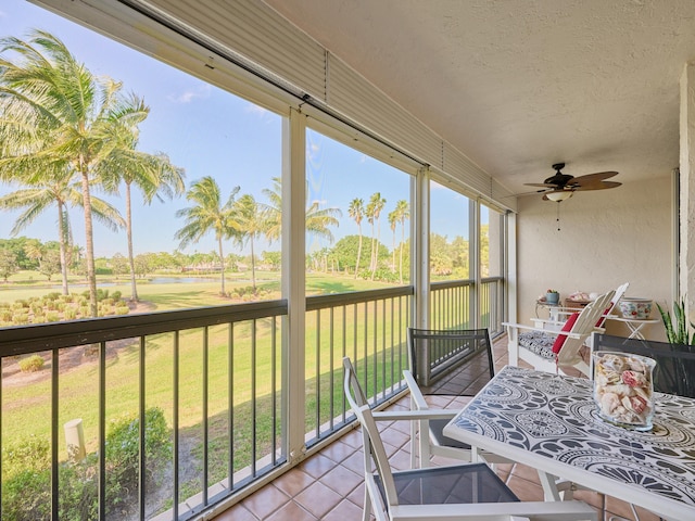 sunroom featuring ceiling fan