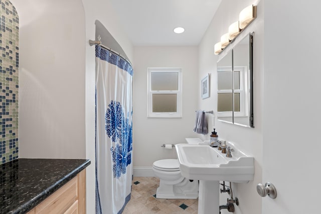 bathroom with sink and toilet