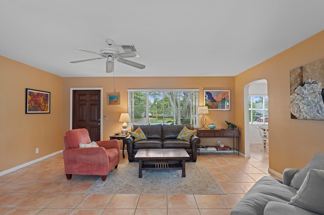 living room with ceiling fan and light tile patterned flooring