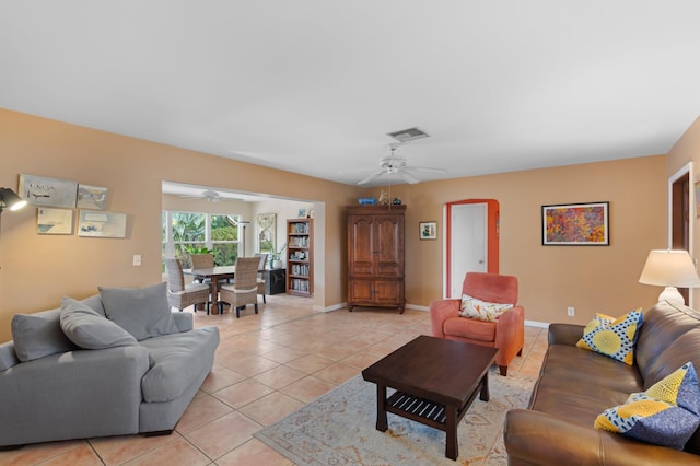 tiled living room with ceiling fan