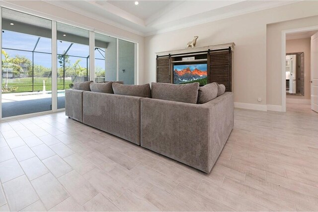 bedroom with a raised ceiling, multiple windows, and visible vents