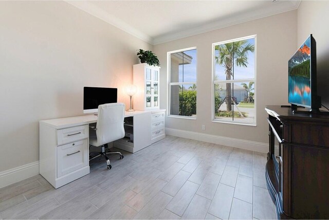 office area with a textured ceiling, crown molding, baseboards, and wood finish floors