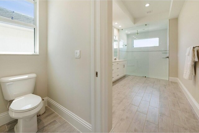 laundry area featuring visible vents, baseboards, washer and clothes dryer, cabinet space, and a textured ceiling