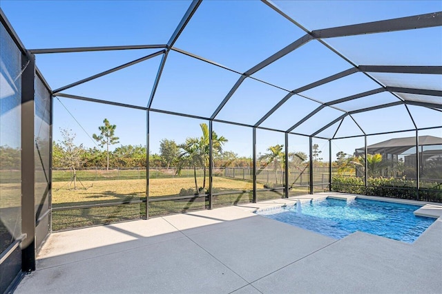 outdoor pool with a lanai and a patio