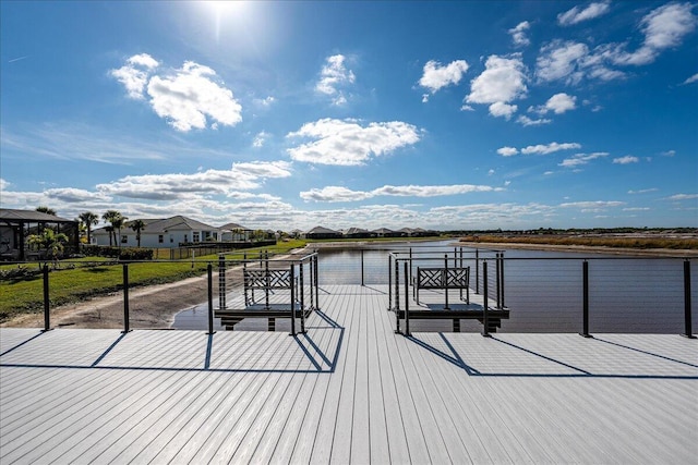 dock area featuring a residential view and a water view