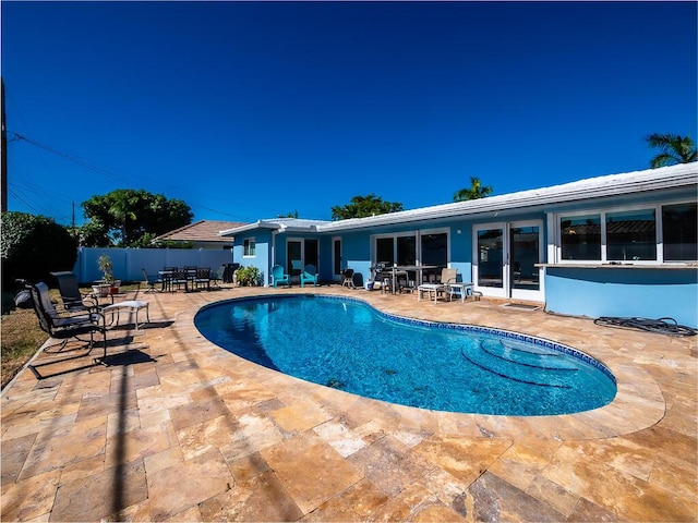 view of swimming pool with a patio area