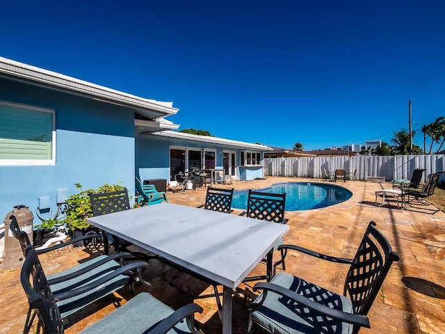 exterior space featuring a fenced in pool