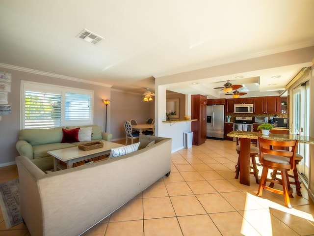 tiled living room featuring ornamental molding