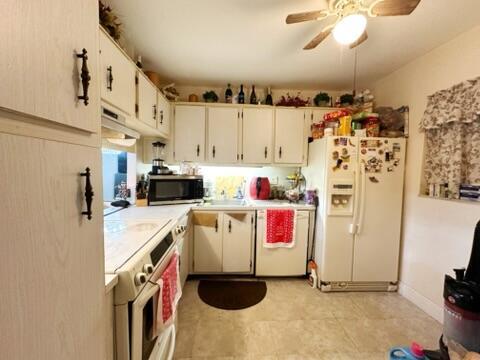 kitchen with white cabinetry, ceiling fan, and appliances with stainless steel finishes