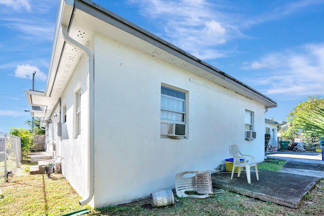 view of side of home with cooling unit