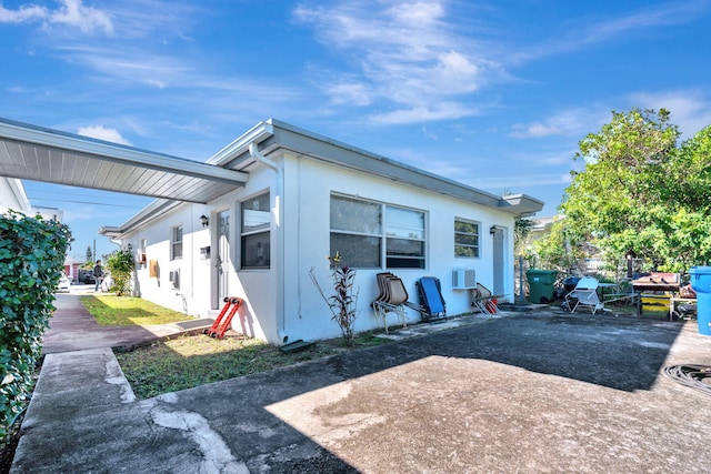 view of side of property featuring a patio