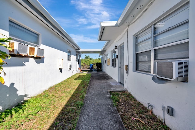 view of side of property with cooling unit