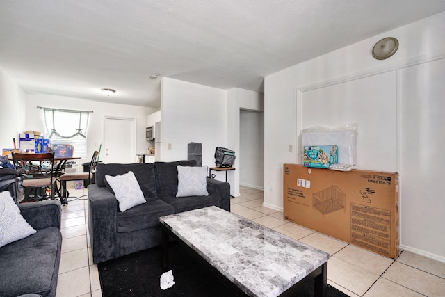 tiled living room with a textured ceiling