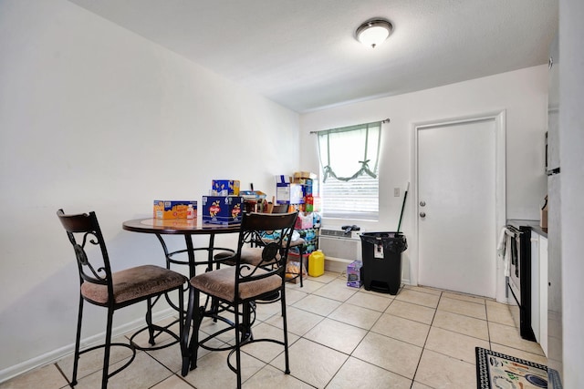 dining space featuring light tile patterned floors