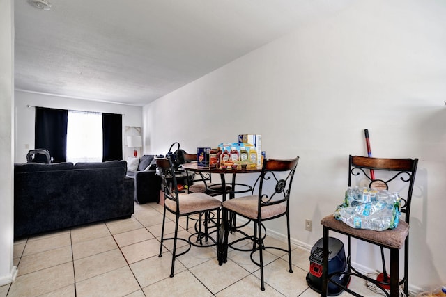 dining space with light tile patterned floors