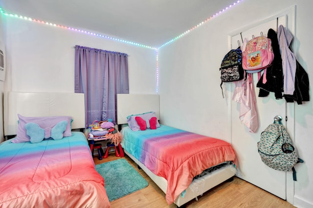 bedroom with hardwood / wood-style floors