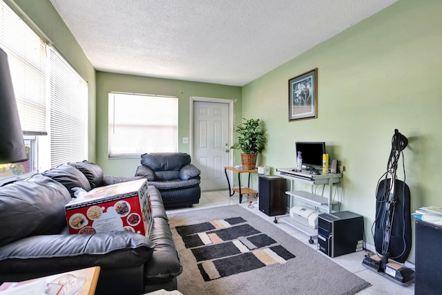 living room with light tile patterned floors and a textured ceiling