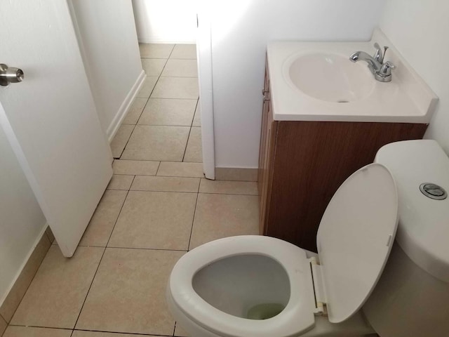 bathroom featuring tile patterned floors, vanity, and toilet